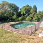 Swimming pool safety fence with swing gate