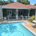 Swimming pool safety fence with swing gate