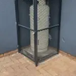 Corner gas bottle cage