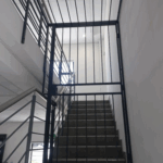 Office stairwell security swing gate with enclosure